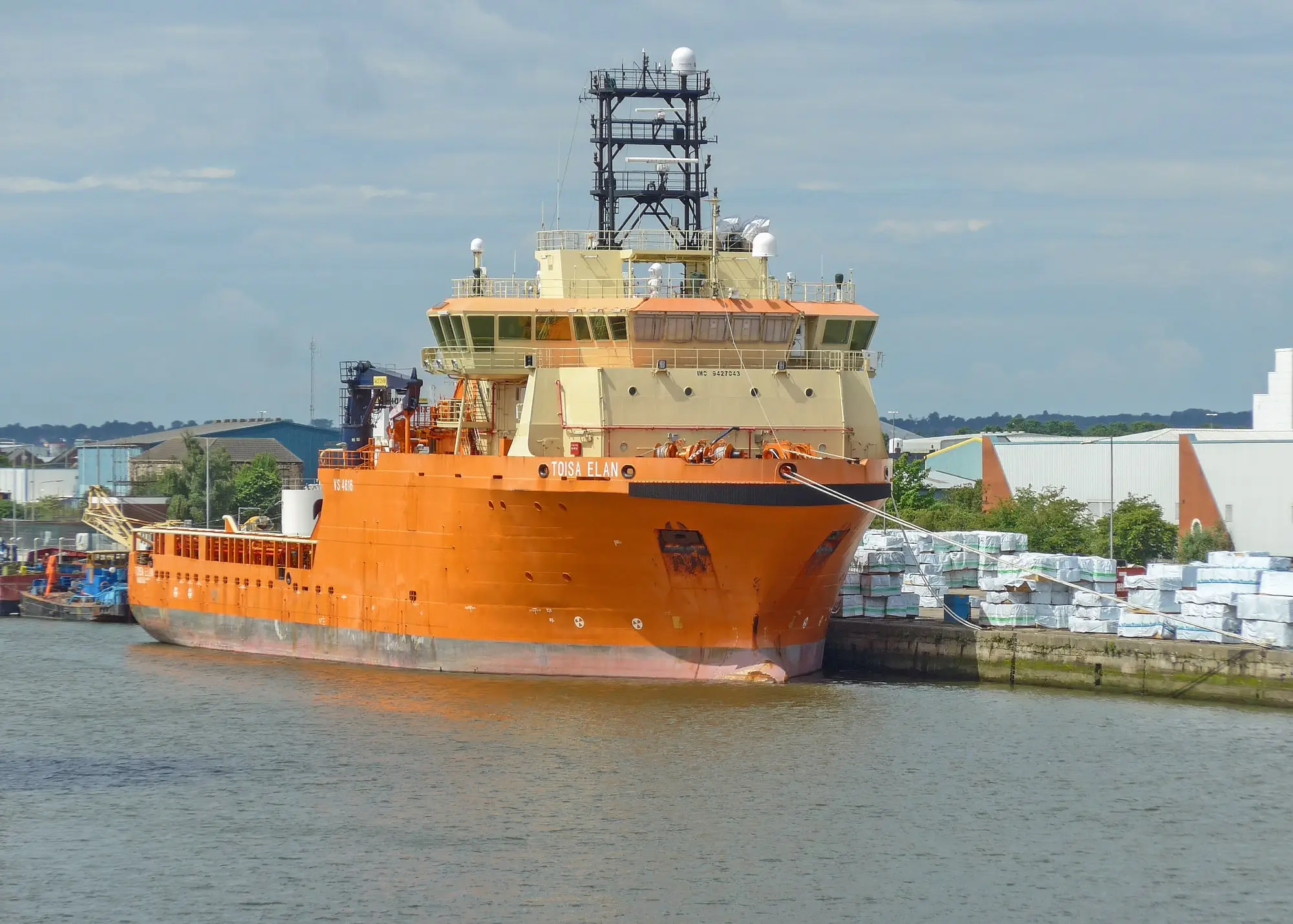 The orange offshore support vessel Toisa Elan moored alongside the quay in the Port of Hull